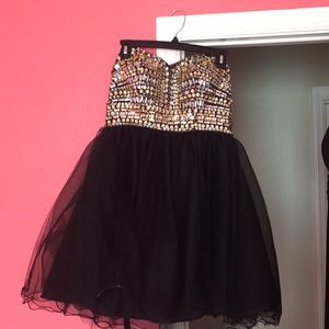 Black and gold short beaded and tool dress.